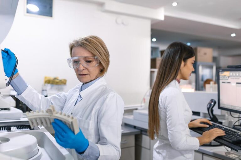Laboratory technicians conduct testing in a lab. More frequently, nitazenes are being detected in workplace drug testing.