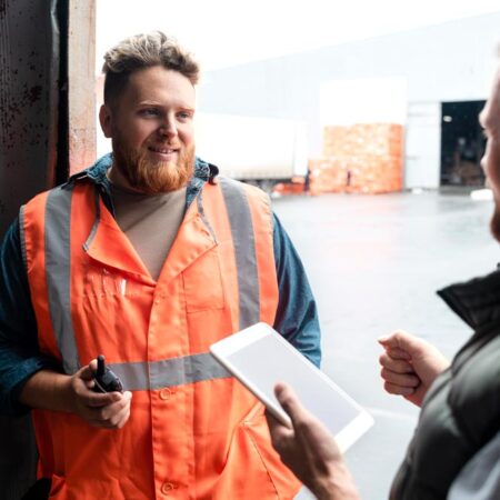 Why employees stay silent about drugs and alcohol issues in the workplace A worker in a warehousing workplace talks to his supervisor about drugs and alcohol misuse and getting support.