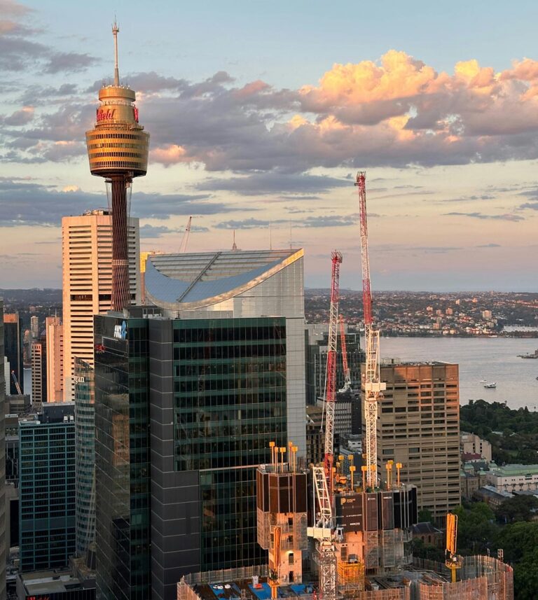 NSW construction is rapidly growing, making drug and alcohol testing in the industry even more important. Credit Ethan Shi https://unsplash.com/photos/a-city-with-a-lot-of-tall-buildings-next-to-a-body-of-water-KmON31AqN30
