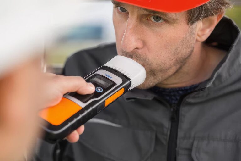 A worker takes a workplace alcohol test. See the workplace drug & alcohol myths that won’t die